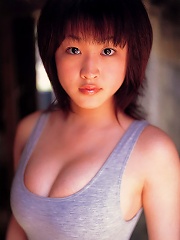 Seductive asian hottie exhibits her big juicey boobs in a bikini